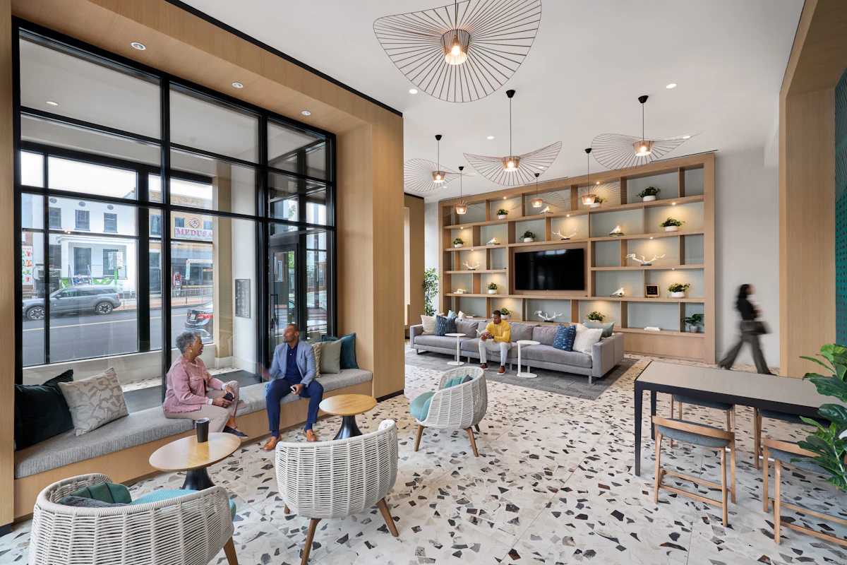 Interiors for The Oliver are defined by a warm, welcoming color palette accented with modern, elegant details. 