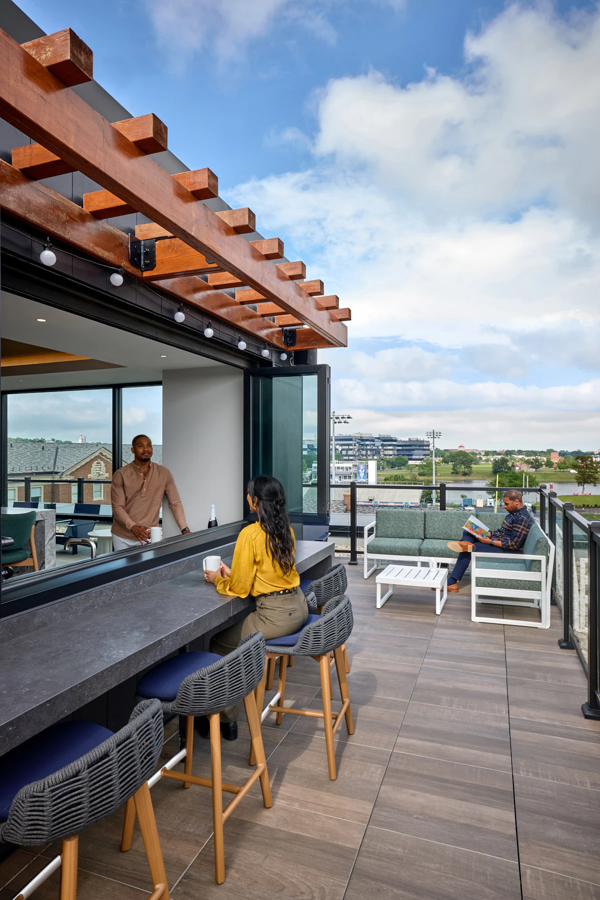 A rooftop deck features an event space and views of the city. 
